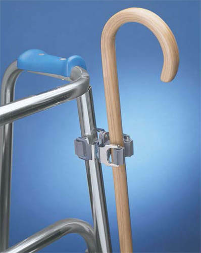 Cane - Accessories Double-clip cane holder allows users to keep a cane handy wherever they may need it * Simply snap one side of the clip onto any tubular structure such as a table leg, walker, commode, wheelchair, or lawn chair * The opposite side of the clip will hold most diameters of canes * The gripping surfaces are soft plastic rollers and will not damage canes * Measures 3 x 2 x 1 3/4